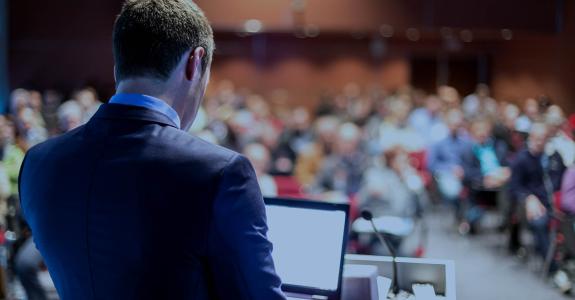Speaker giving a talk on corporate business conference. 